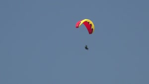 Stock Video Man In A Red Paraglide In The Sky Animated Wallpaper