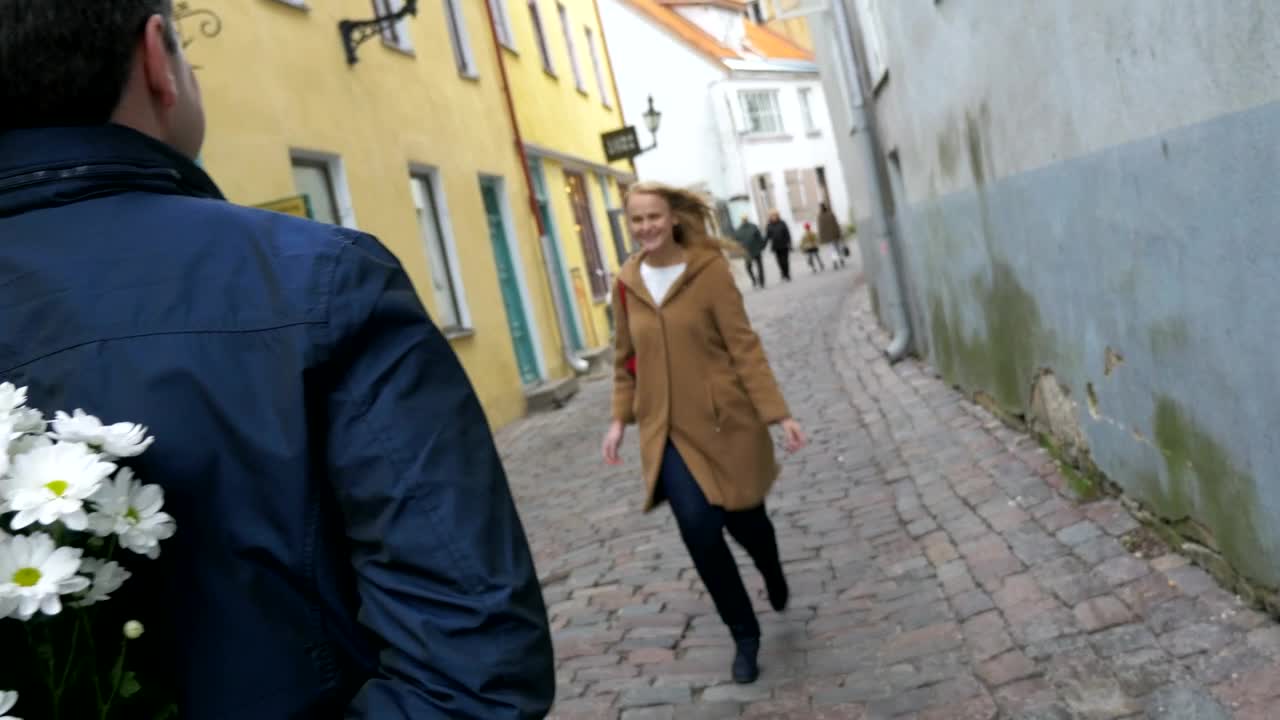 Download Stock Video Man Handing A Woman Flowers Animated Wallpaper