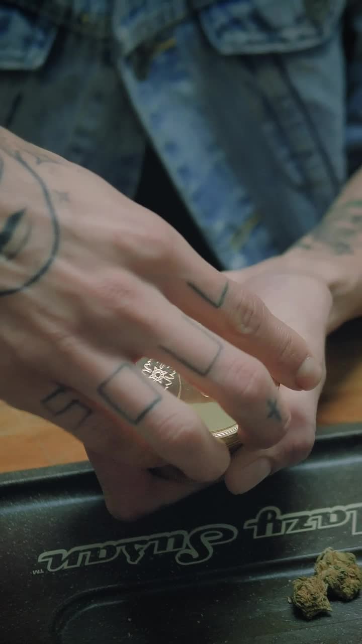 Download Stock Video Man Grinding Weed In A Grinder Animated Wallpaper