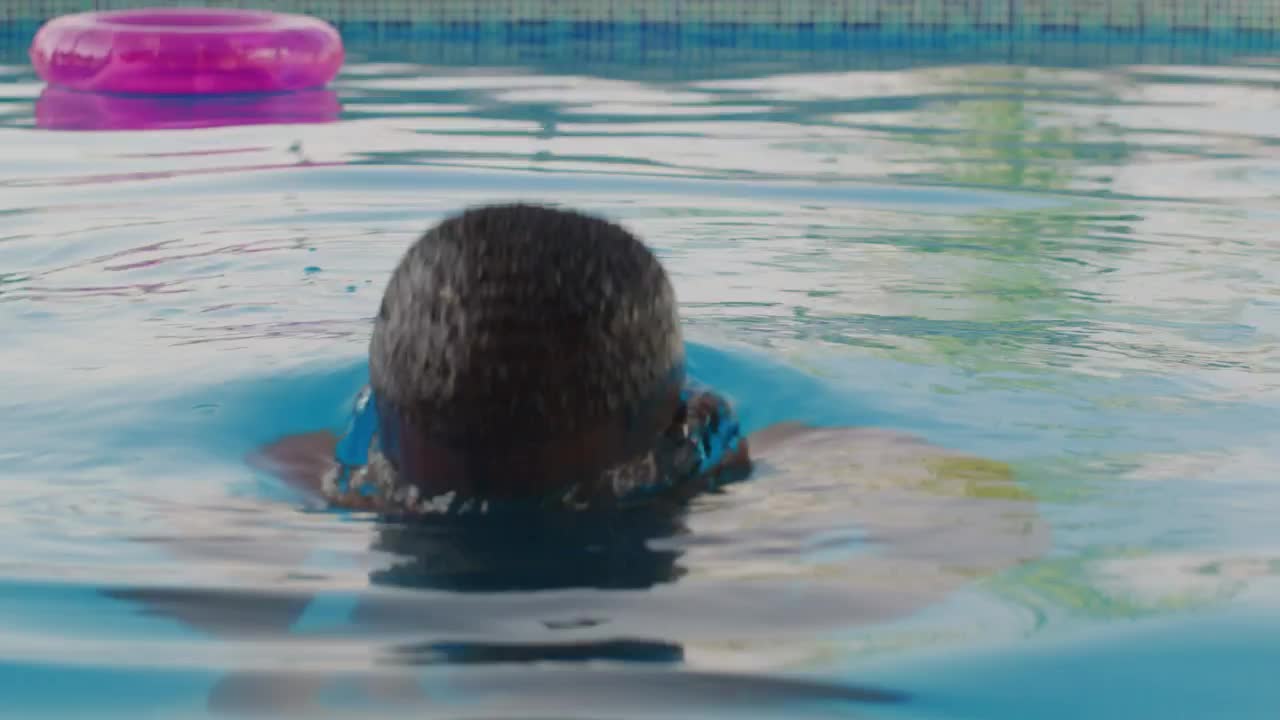 Download Stock Video Man Getting Out Of The Water In A Pool Animated Wallpaper