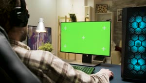 Stock Video Man Gaming At Home With Green Screen Monitor Animated Wallpaper