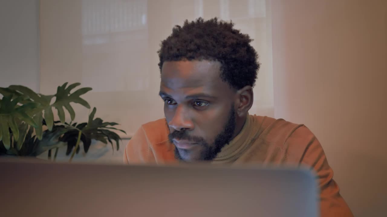 Download Stock Video Man Finishing Work On His Laptop Animated Wallpaper