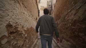 Stock Video Man Exploring Urban Corridors In Morocco Animated Wallpaper