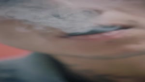 Stock Video Man Exhaling Marijuana Smoke Animated Wallpaper