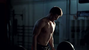 Stock Video Man Exercising With The Barbell At The Gym Animated Wallpaper