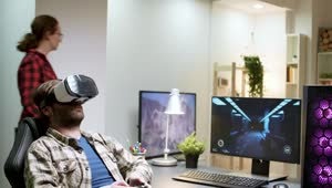 Stock Video Man Enjoys Virtual Gaming In Home Office Animated Wallpaper