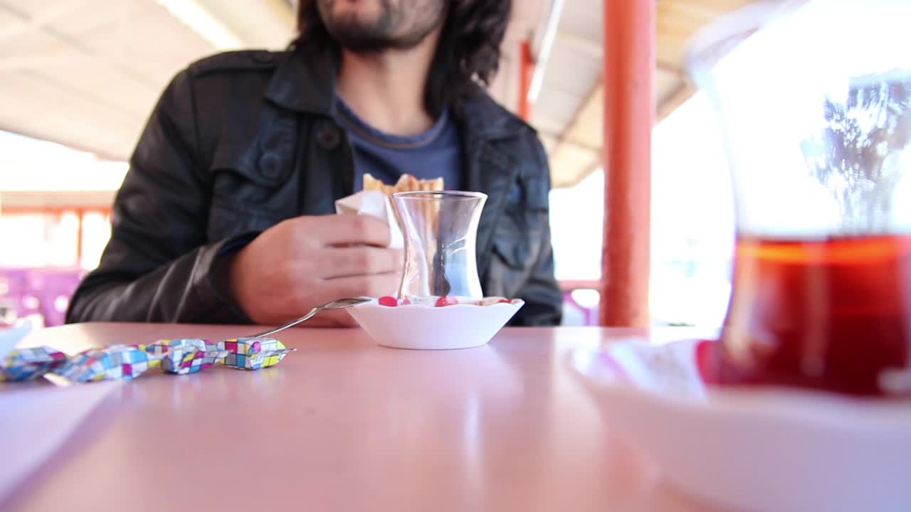 Download Stock Video Man Eating A Bread Sitting On A Dining Room Table Animated Wallpaper