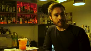 Stock Video Man Drinking A Prepared Red Drink In A Bar Animated Wallpaper