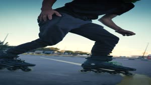 Stock Video Man Doing Tricks With Roller Skates In A Parking Lot Animated Wallpaper