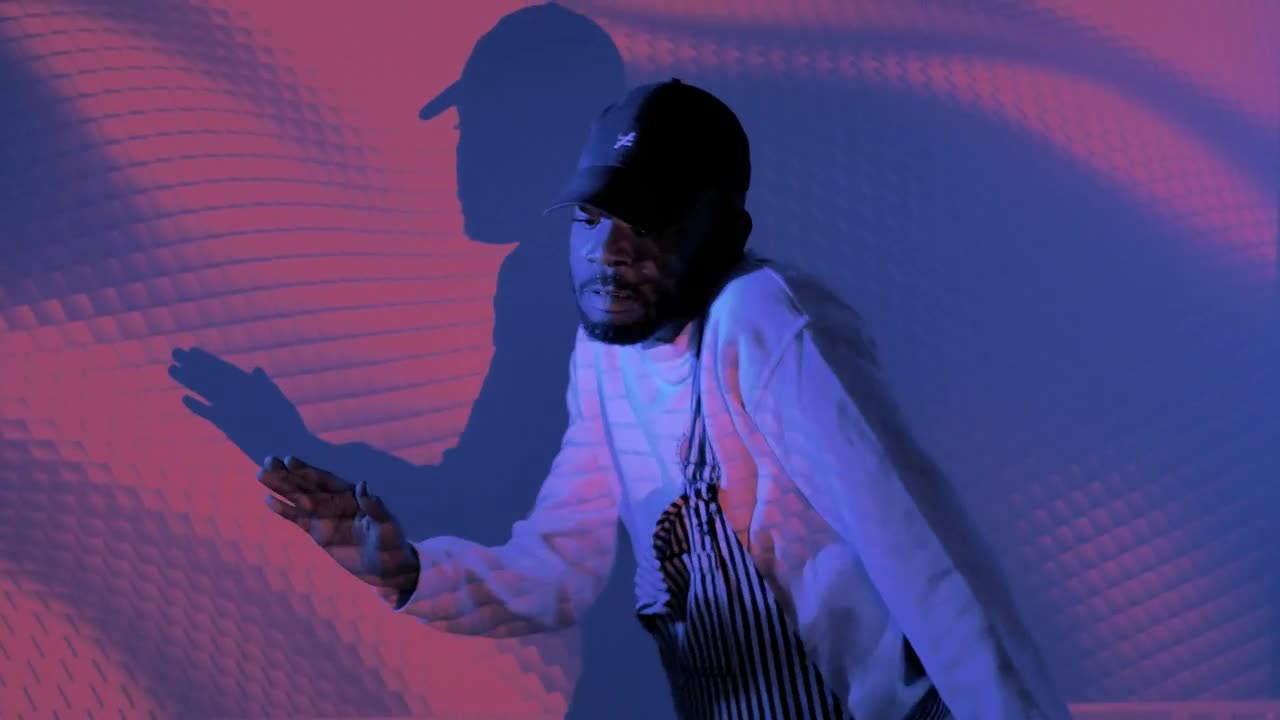 Download Stock Video Man Dancing With Shapes Projected On Him Animated Wallpaper