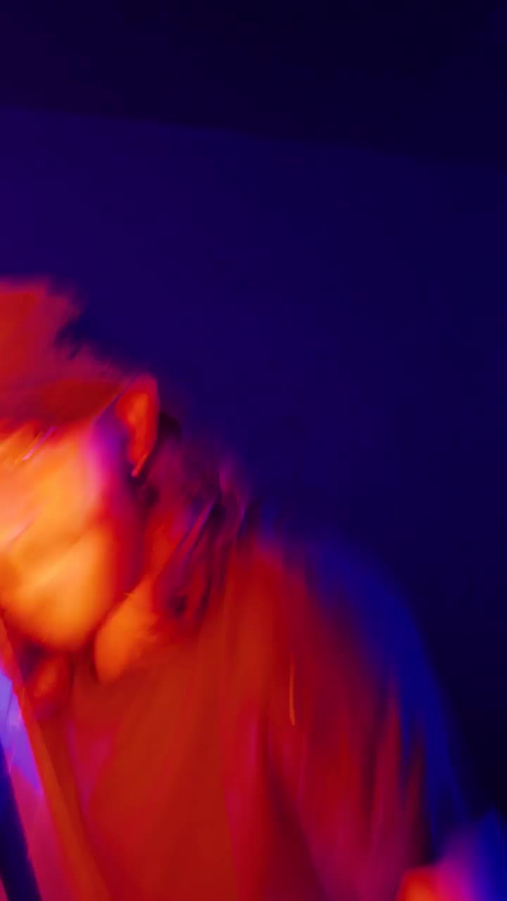 Download Stock Video Man Dancing With An Orange Light Bar Animated Wallpaper