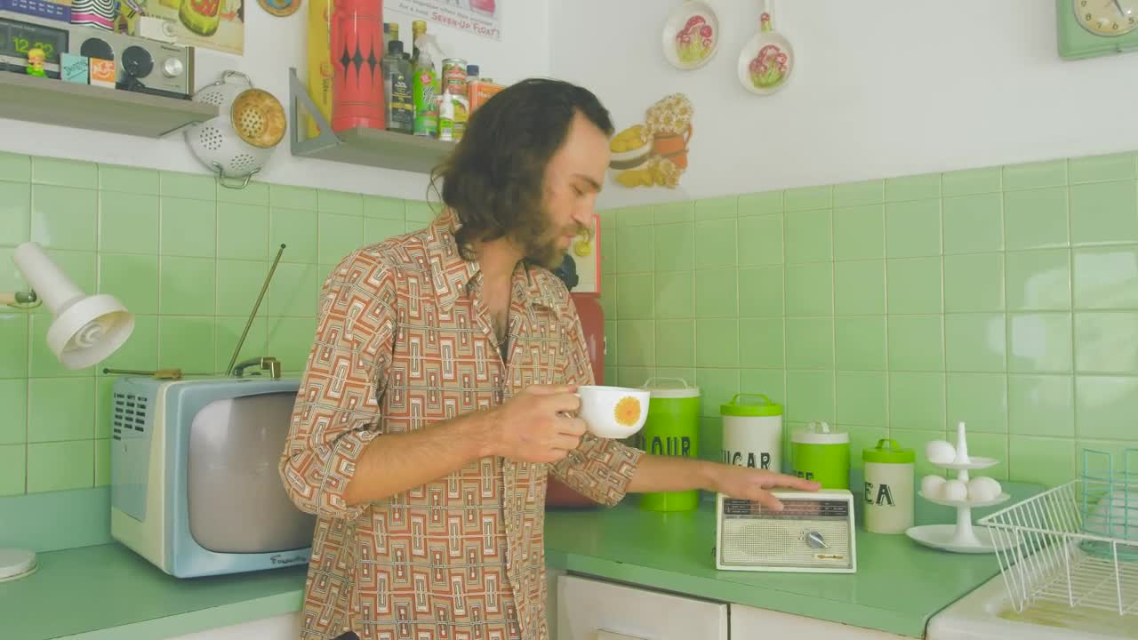 Download Stock Video Man Dancing While Drinking Coffee In An S Kitchen Animated Wallpaper