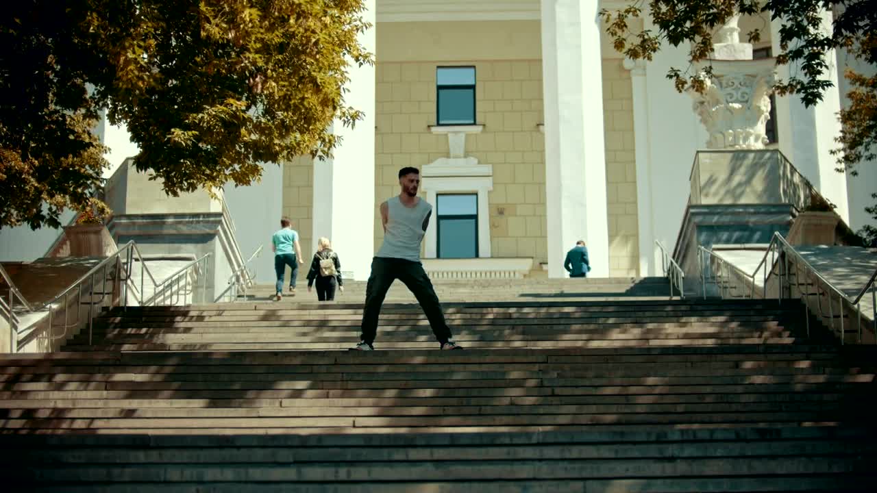 Download Stock Video Man Dancing On Some Stairs In The Street Animated Wallpaper