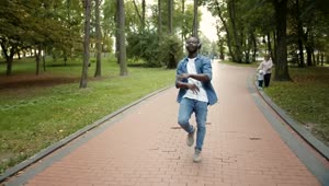 Stock Video Man Dances To Hiphop While Walking In Park Animated Wallpaper