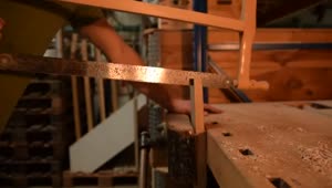 Stock Video Man Cutting A Wooden Board With A Large Lock Smal Animated Wallpaper
