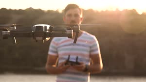 Stock Video Man Controlling Drone With With Remote Controller Animated Wallpaper