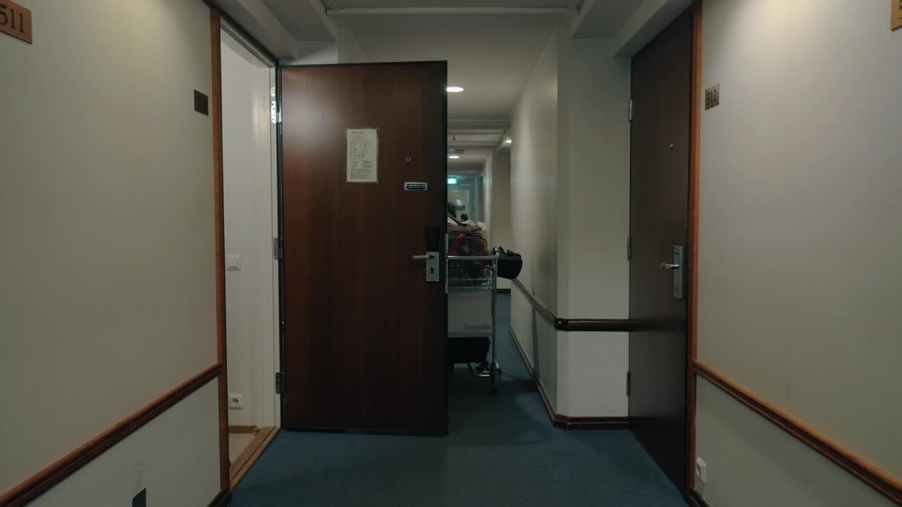 Download Stock Video Man Checking Out Of A Hotel Room Animated Wallpaper