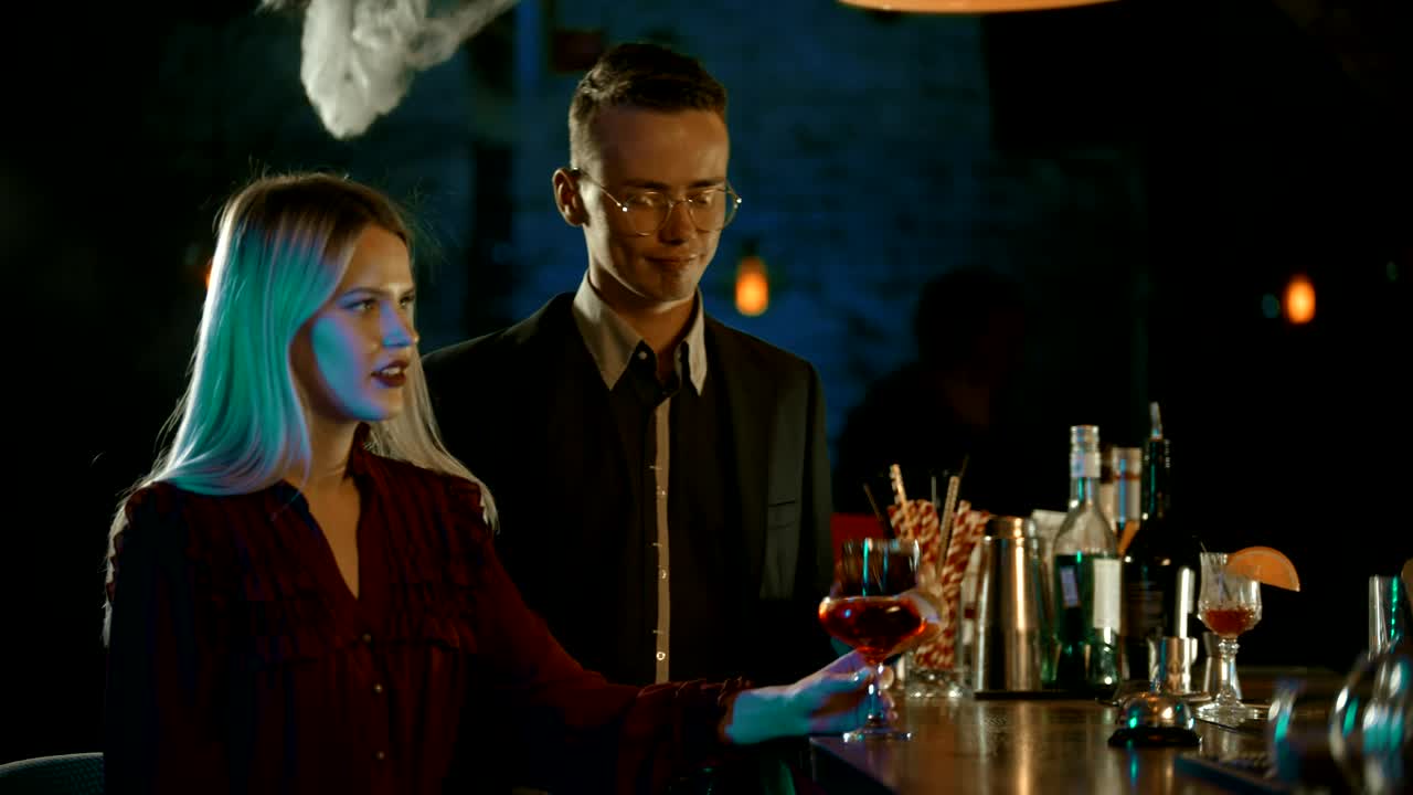 Download Stock Video Man And Woman Toasting In A Bar Animated Wallpaper