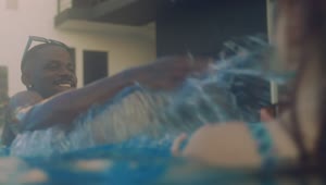 Stock Video Man And Woman Playing In The Pool Animated Wallpaper