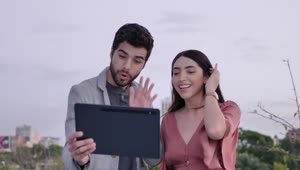 Stock Video Man And Woman Outdoors During A Video Call Animated Wallpaper