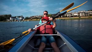 Stock Video Man And Son Doing Kayak On A Sunny Day Animated Wallpaper
