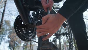 Stock Video Man Adjusting The Pedals Of His Bicycle Animated Wallpaper