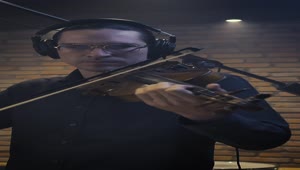 Stock Video Male Violinist Playing In A Recording Studio Animated Wallpaper