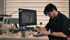 Stock Video Male Designer Working In His Studio Animated Wallpaper