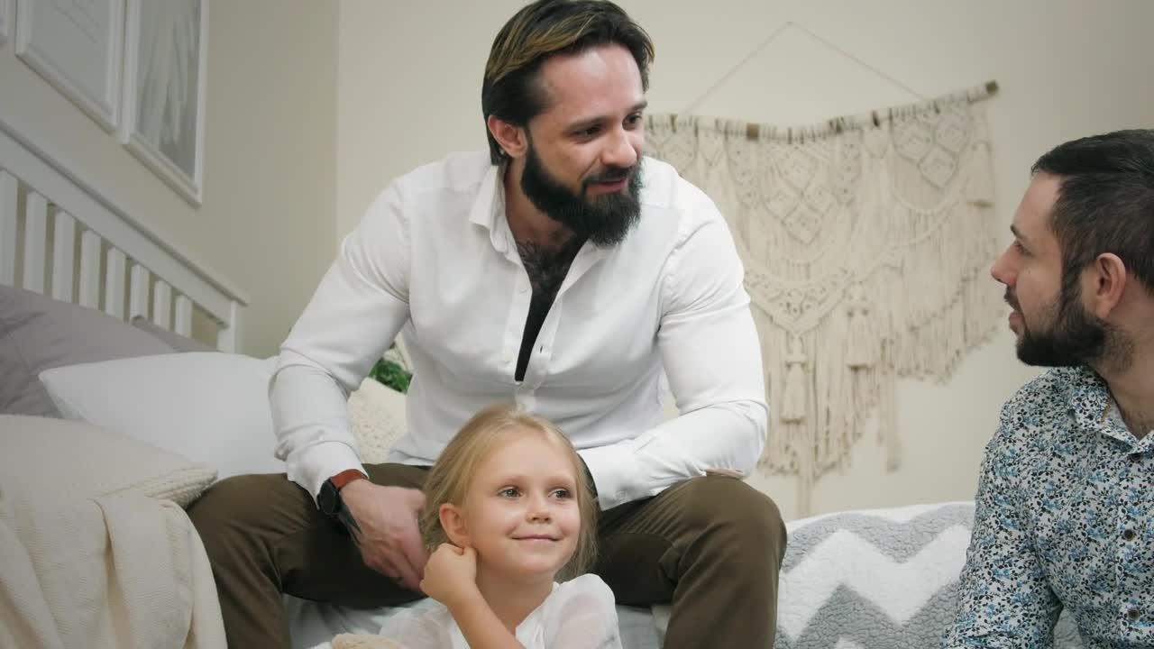 Download Stock Video Male Couple And Daughter At Home Animated Wallpaper