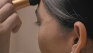 Stock Video Making Up A Womans Face With A Brush Animated Wallpaper