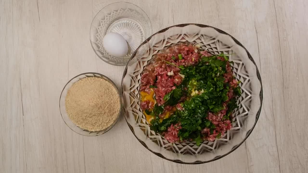 Download Stock Video Making Breaded Meat Animated Wallpaper