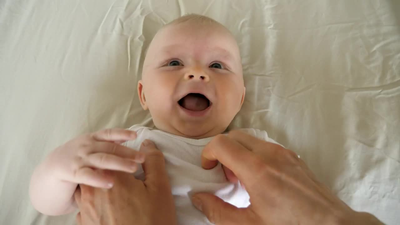 Download Stock Video Making A Little Baby Laugh Animated Wallpaper