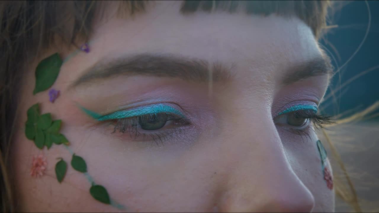 Download Stock Video Makeup Eyes Of A Woman With The Wind Blowing Her Animated Wallpaper