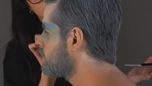 Stock Video Makeup Artist Painting A Mans Face In Winter Concept Animated Wallpaper