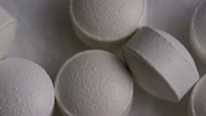 Stock Video Macro Shot Of White Compressed Pills Animated Wallpaper