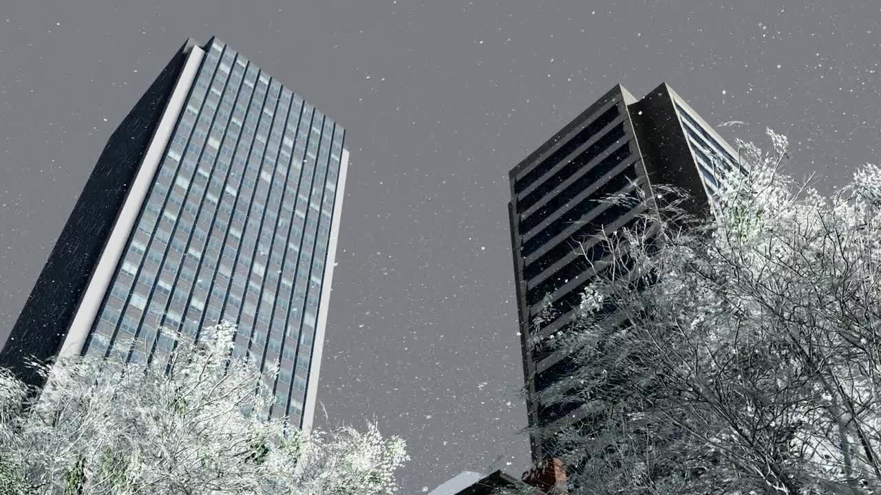 Download Stock Video Low View Of An Office Building While Snowing Animated Wallpaper