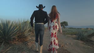 Stock Video Loving Couple Walking Through A Mexican Ranch Animated Wallpaper