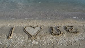 Stock Video Love Written In The Sand On A Beach Animated Wallpaper
