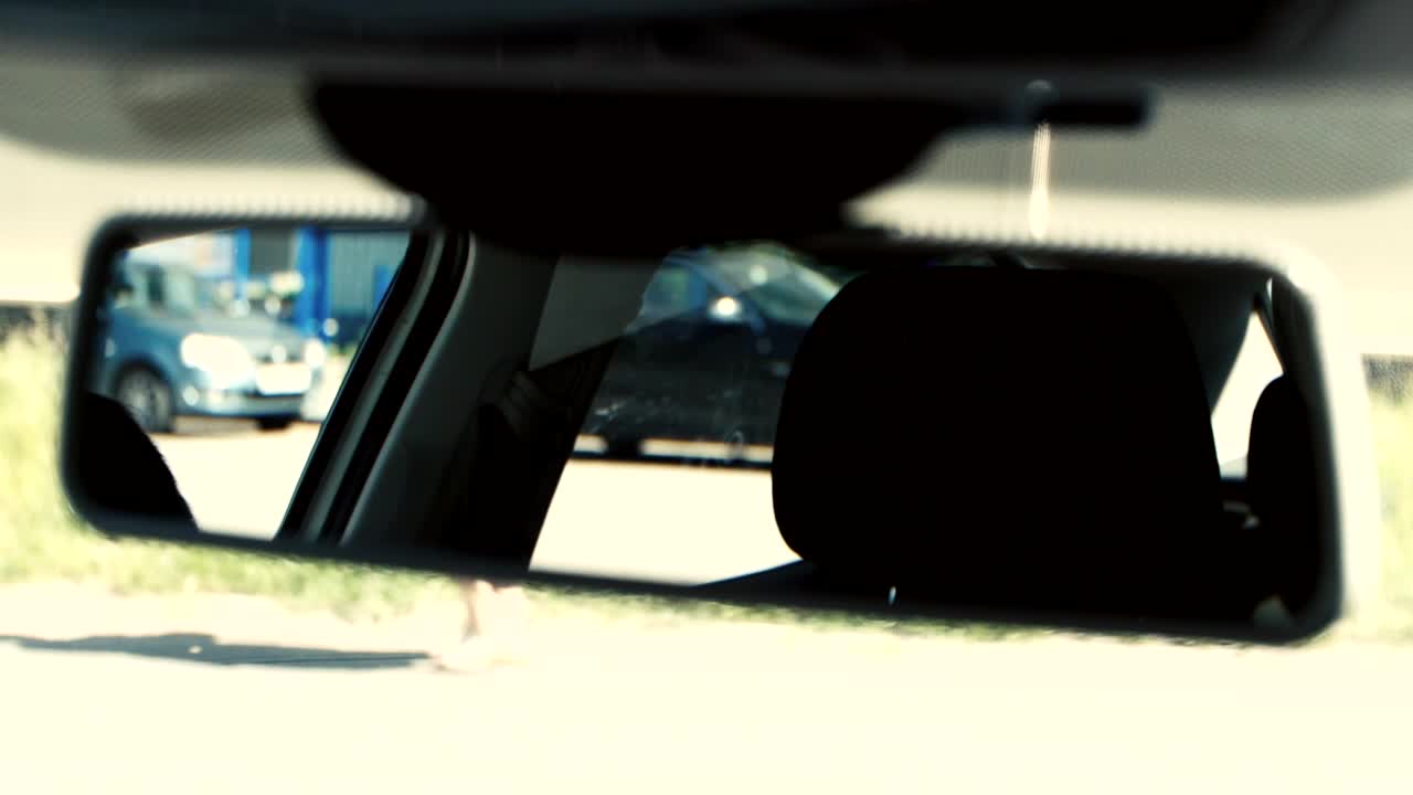Download Stock Video Looking In A Car Mirror Animated Wallpaper