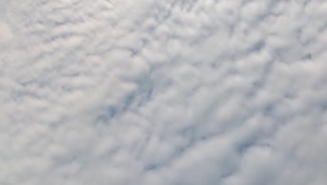 Stock Video Looking Down Over Puffy Clouds Animated Wallpaper