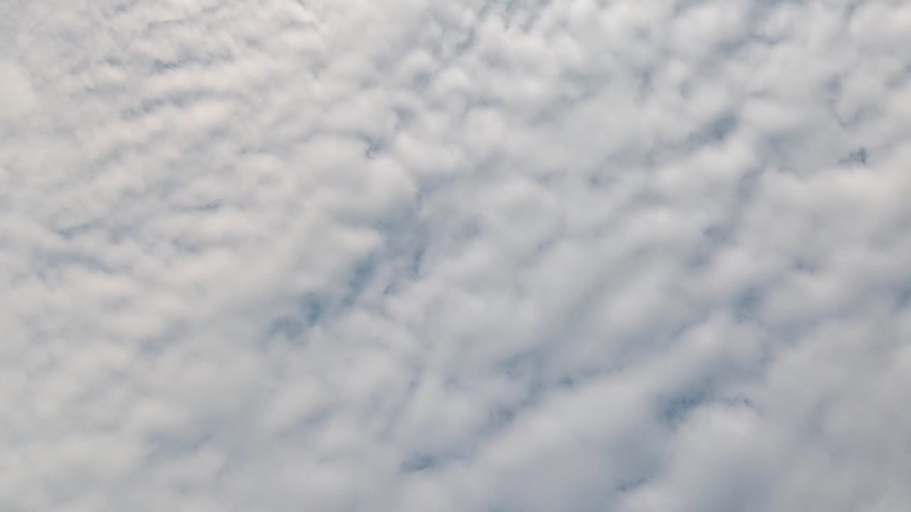 Download Stock Video Looking Down Over Puffy Clouds Animated Wallpaper