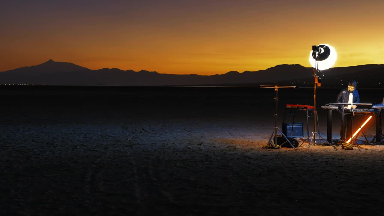 Download Stock Video Lonely Dj Playing Music In A Huge Empty Desert Animated Wallpaper