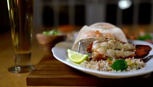 Stock Video Lobster Served With Rice And Lemon Animated Wallpaper