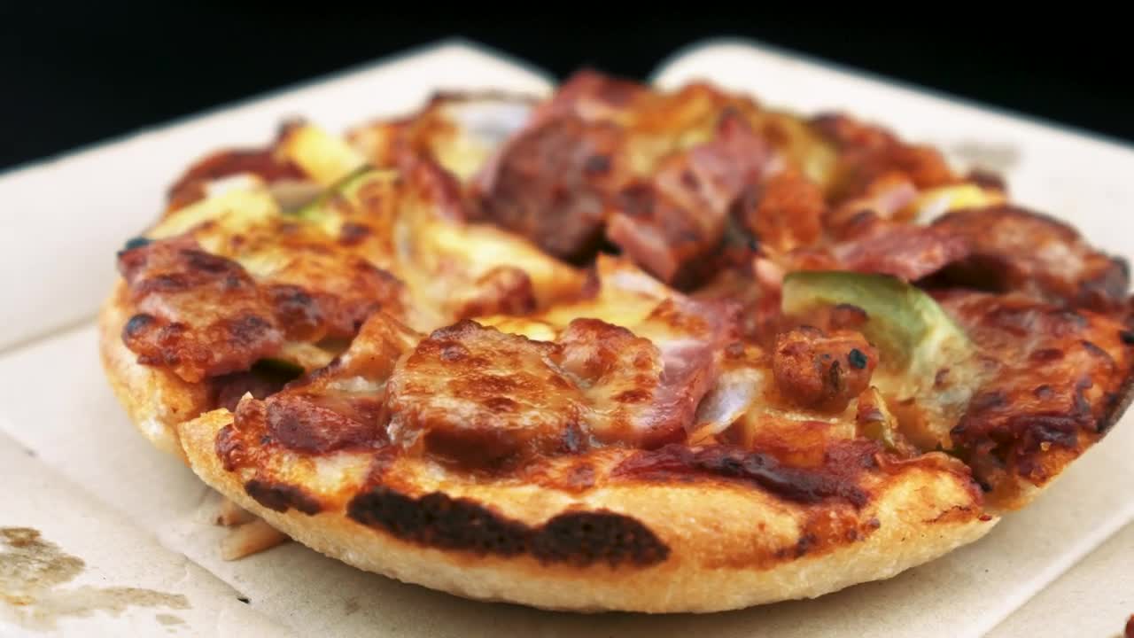 Download Stock Video Little Pizza Slowly Turning Animated Wallpaper