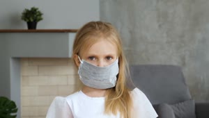 Stock Video Little Girl Wearing A Face Mask At Home Animated Wallpaper