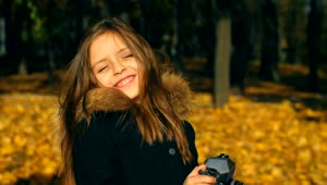 Stock Video Little Girl Taking Photos With A Camera Animated Wallpaper