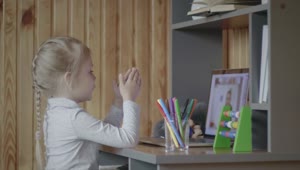 Stock Video Little Girl Taking Classes Online Animated Wallpaper