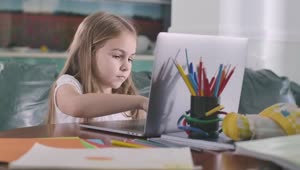 Stock Video Little Girl Studying On A Computer Animated Wallpaper