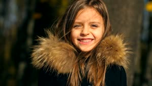 Stock Video Little Girl Smiling In A Winter Coat Animated Wallpaper