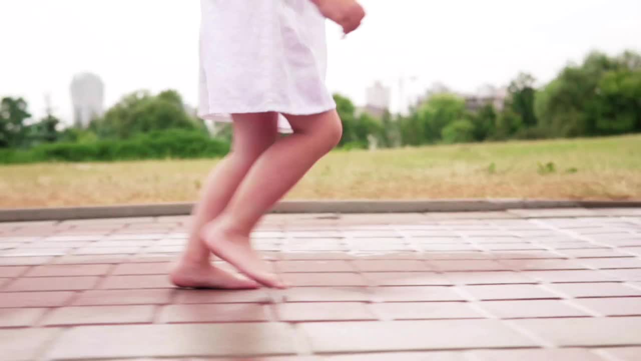 Download Stock Video Little Girl Running In The Rain Animated Wallpaper